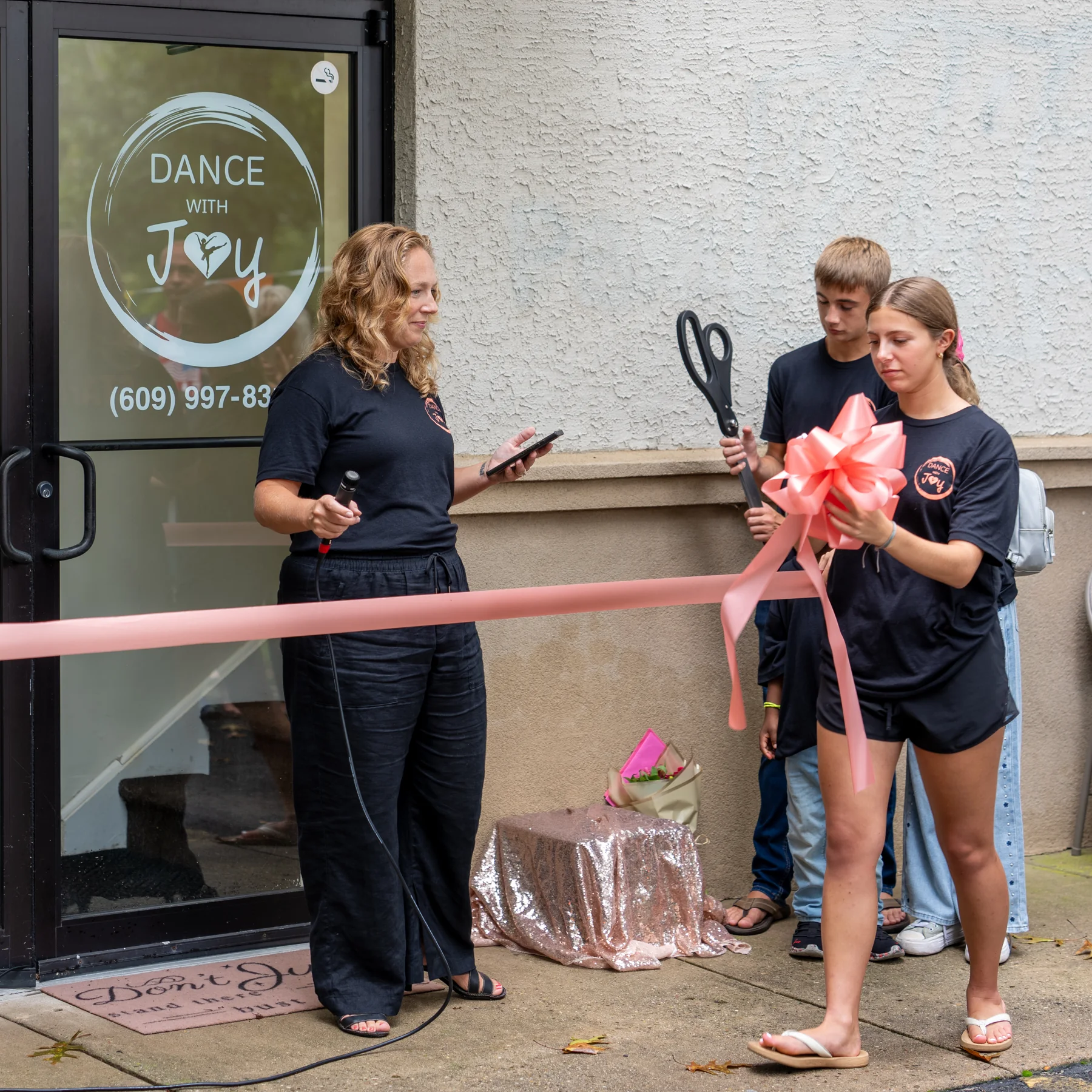 Dance with Joy ribbon-cutting celebration outside the studio