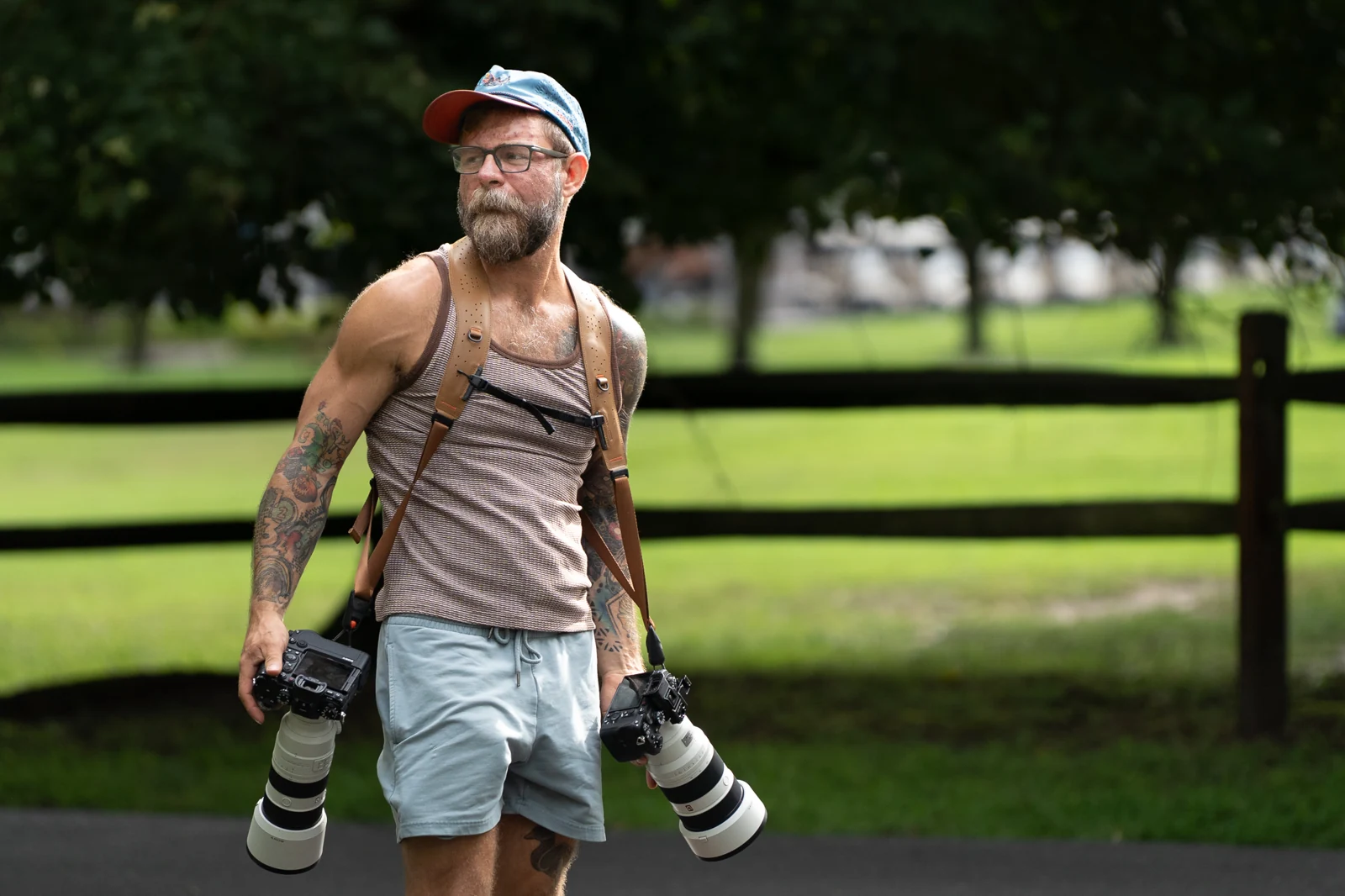 Francis outdoors at work with two cameras